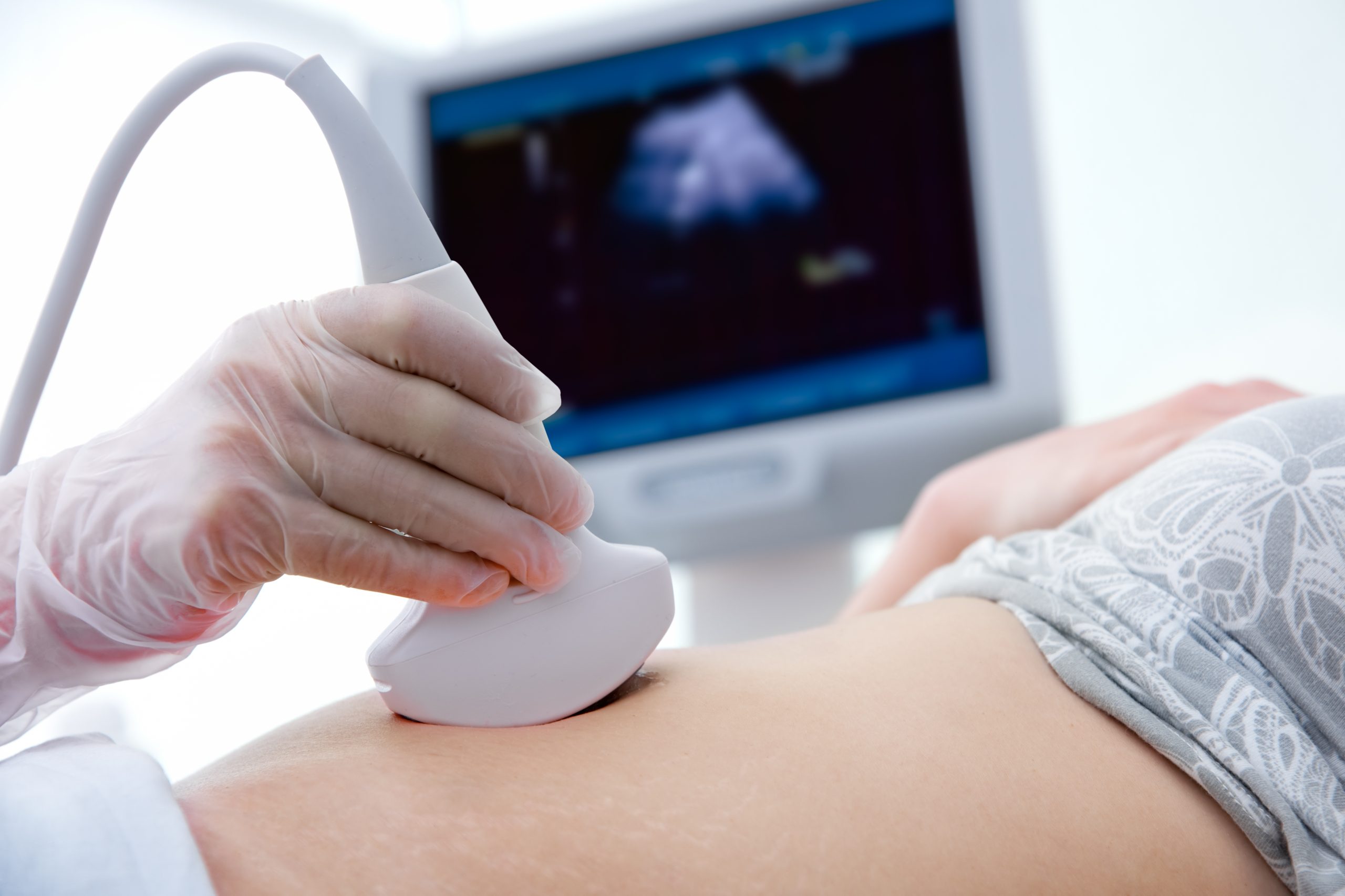 A gynaecologist performs an ultrasound to assess a woman’s reproductive health.