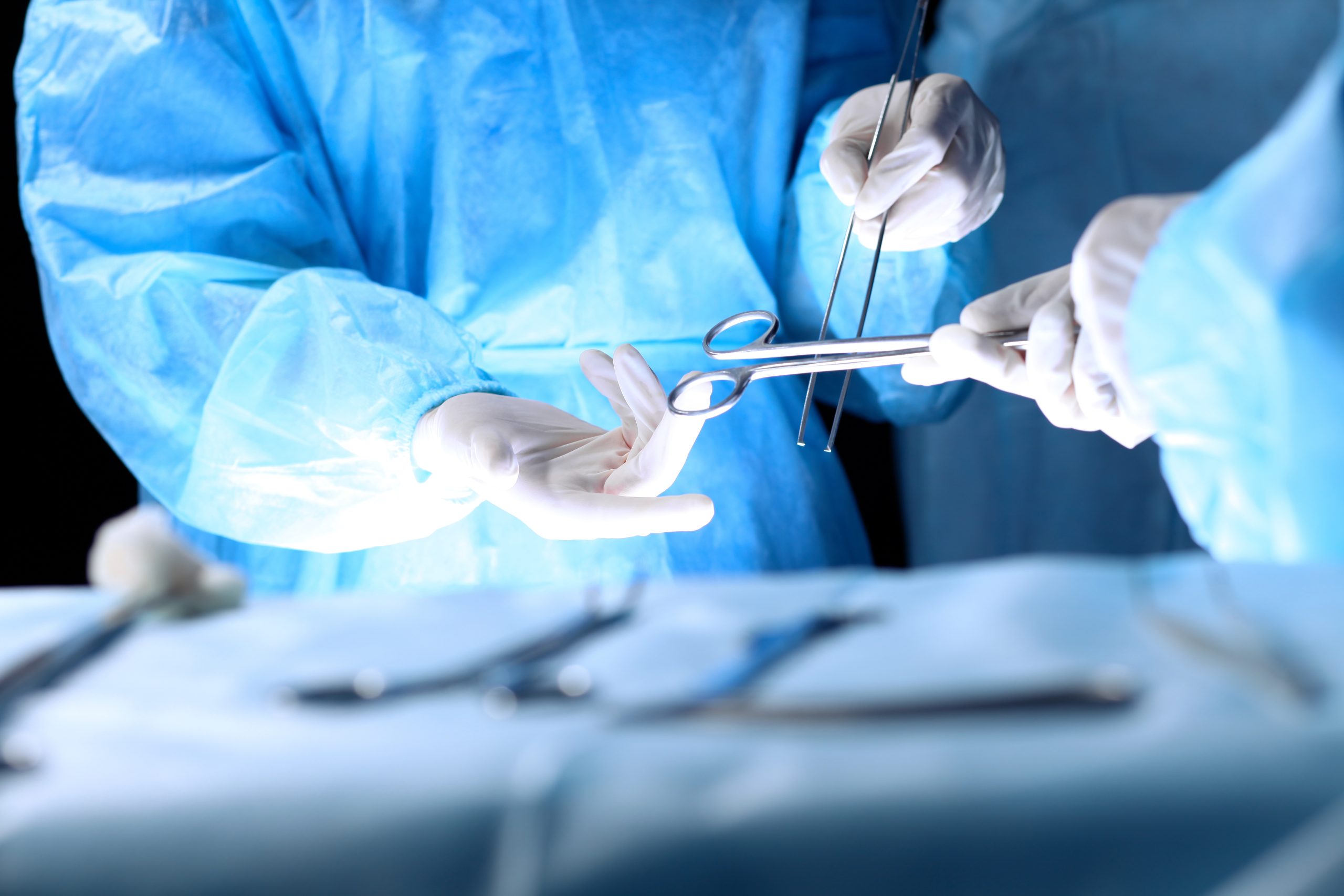 An obstetrician-gynaecologist preparing for fibroid surgery.