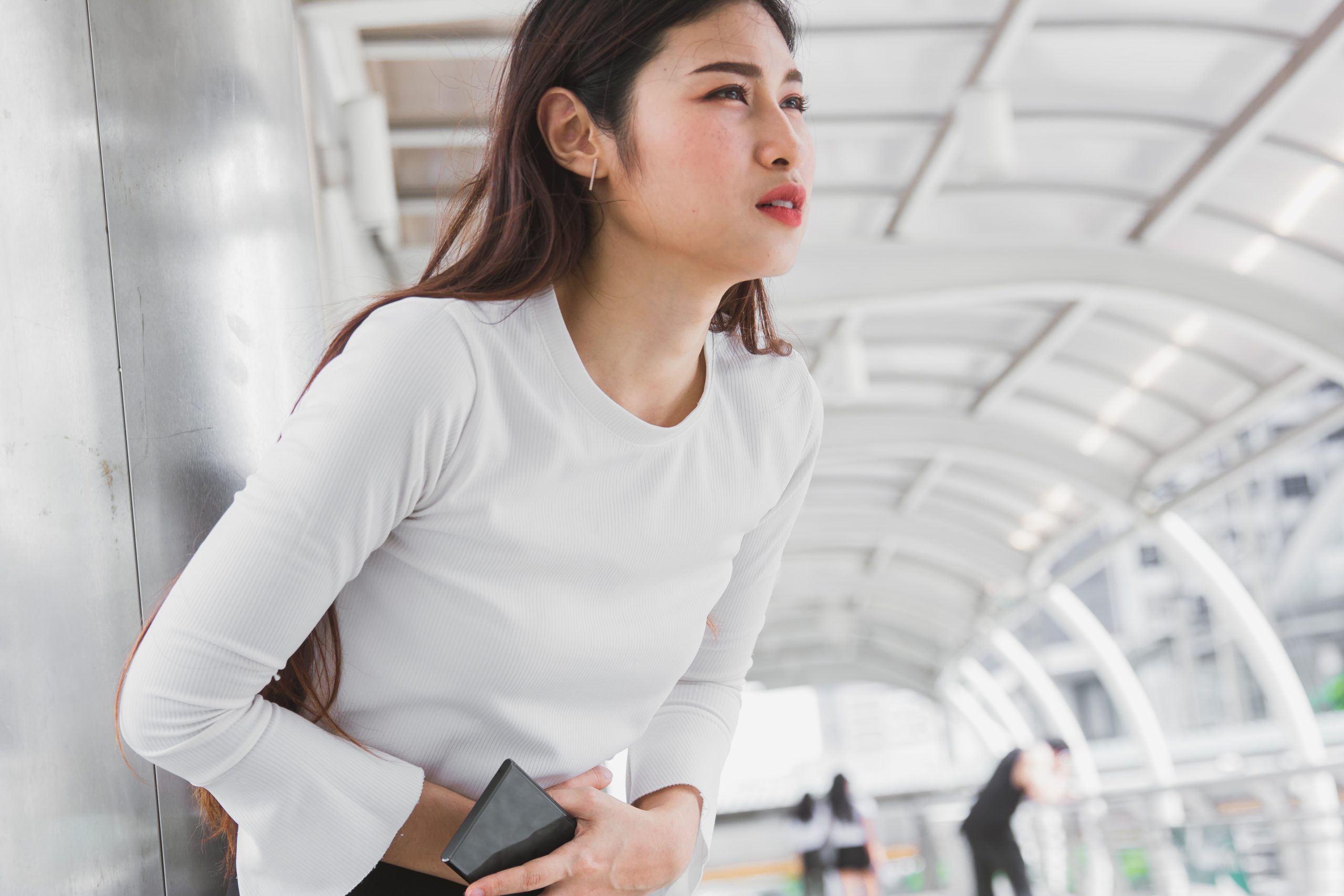 A woman experiencing severe period pain